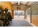 Barn with multiple stalls and an open doorway to the horse paddock at 5700 S University Blvd, Greenwood Village, CO 80121