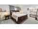 Bedroom with a large bed, natural light, and closet storage at 5700 S University Blvd, Greenwood Village, CO 80121