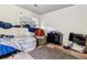 Small bedroom with a bed, chair, dresser, and television; great for relaxing at 17703 E Nassau Pl, Aurora, CO 80013