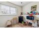 Small room with a window, mini fridge, microwave, and other miscellaneous items at 17703 E Nassau Pl, Aurora, CO 80013