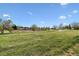 Scenic shot of the community with a walking path, green space, and blue skies at 17703 E Nassau Pl, Aurora, CO 80013