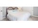 Bedroom boasts a wood-frame bed, plush carpeting, and easy access to both closet and bedroom doors at 577 Tristan Pl, Berthoud, CO 80513