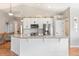 Stylish kitchen island with granite countertops and modern appliances at 577 Tristan Pl, Berthoud, CO 80513