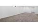 Spacious finished basement featuring neutral carpet, ample lighting, and a walkout entrance at 7600 Kearney Dr, Commerce City, CO 80022
