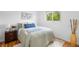 Cozy bedroom with a plush rug, window view, and a comfortable bed at 7600 Kearney Dr, Commerce City, CO 80022