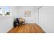 Simple bedroom with hardwood floors, natural light, and closet space at 7600 Kearney Dr, Commerce City, CO 80022