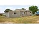 Home exterior view featuring siding, a well-maintained yard, and a side door at 7600 Kearney Dr, Commerce City, CO 80022