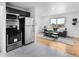Modern kitchen with stainless steel appliances open to the cozy living area at 7600 Kearney Dr, Commerce City, CO 80022