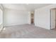 Spacious bonus room featuring neutral carpet, white walls, and abundant natural light at 1836 Westport Ave, Berthoud, CO 80513