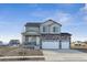 Charming two-story home with a stone and vinyl exterior, three car garage, and a covered front porch at 1836 Westport Ave, Berthoud, CO 80513