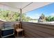 Relaxing balcony space with seating, providing a serene outdoor retreat with views of lush greenery at 7930 S Kendall Ct, Littleton, CO 80128