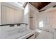 Bright bathroom featuring a jacuzzi tub and separate shower, perfect for relaxation and spa-like comfort at 7930 S Kendall Ct, Littleton, CO 80128
