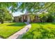 Inviting single-Gathering home with a well-maintained lawn and cozy front porch at 7930 S Kendall Ct, Littleton, CO 80128