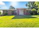 Charming single-Gathering home featuring a manicured front lawn and inviting entrance at 7930 S Kendall Ct, Littleton, CO 80128