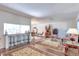 Open concept living room featuring wood floors, recessed lighting, and dining area at 7930 S Kendall Ct, Littleton, CO 80128