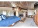 Spacious primary bedroom with wood ceiling, providing a retreat with great ceiling features and natural light at 7930 S Kendall Ct, Littleton, CO 80128