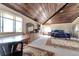 Expansive primary bedroom with wood-paneled ceilings, offering a luxurious retreat and ample space at 7930 S Kendall Ct, Littleton, CO 80128