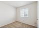 This bedroom has neutral carpeting and a window providing natural light at 10806 Crooke Dr, Parker, CO 80134