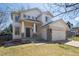 Charming two-story home with a welcoming front porch and a well-maintained lawn at 10806 Crooke Dr, Parker, CO 80134