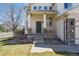 Inviting covered front porch with stately columns and a beautifully landscaped entrance at 10806 Crooke Dr, Parker, CO 80134
