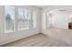Bright living room with a bank of windows and view to the adjacent room at 10806 Crooke Dr, Parker, CO 80134