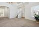 Bright living room featuring high ceilings, large windows, and a staircase at 10806 Crooke Dr, Parker, CO 80134