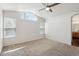 Spacious main bedroom features vaulted ceilings, a ceiling fan, and a view to the bathroom at 10806 Crooke Dr, Parker, CO 80134