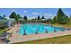 A spacious community pool featuring lounge chairs and a covered area perfect for residents at 10806 Crooke Dr, Parker, CO 80134