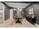 Basement wet bar with a dark wood bar and a cowhide rug at 7036 E Archer Pl, Denver, CO 80230