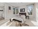 Charming bedroom with a comfortable bed and natural light at 7036 E Archer Pl, Denver, CO 80230