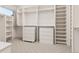 Large walk-in closet with ample shelving and drawers at 7036 E Archer Pl, Denver, CO 80230