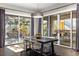 Bright dining room with sliding glass doors leading to deck at 7036 E Archer Pl, Denver, CO 80230