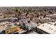 A modern residential building is surrounded by trees in an aerial view at 1473 N Locust St, Denver, CO 80220