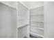 Walk-in closet with ample shelving and hanging space at 1473 N Locust St, Denver, CO 80220