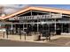 Exterior view of La Fillette Bakery shows outdoor seating and ample parking at 1473 N Locust St, Denver, CO 80220