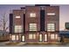 Modern brick townhouse exterior with large windows and black accents create an appealing contemporary aesthetic at 1473 N Locust St, Denver, CO 80220