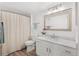 Clean bathroom with vanity, neutral colors, and an updated shower at 8615 W Berry Ave # 203, Littleton, CO 80123