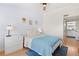 Well-lit bedroom showcasing a comfortable bed, soft decor, and minimalist design at 8615 W Berry Ave # 203, Littleton, CO 80123