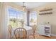 Bright dining space with natural light and charming details such as shelving and lighting at 8615 W Berry Ave # 203, Littleton, CO 80123