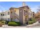 Inviting exterior showcasing the well-maintained facade of the two-story condo building in a desirable community at 8615 W Berry Ave # 203, Littleton, CO 80123