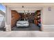Spacious garage with a car, offering parking and ample storage, and is well-lit at 8615 W Berry Ave # 203, Littleton, CO 80123