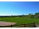 Expansive community greenspace featuring a baseball field and a lush green space at 8615 W Berry Ave # 203, Littleton, CO 80123
