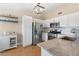 Bright kitchen featuring stainless steel appliances, granite countertops, and ample cabinet space at 8615 W Berry Ave # 203, Littleton, CO 80123