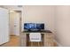 Functional office space with a work desk setup and ample lighting at 8615 W Berry Ave # 203, Littleton, CO 80123