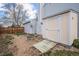 View of fenced-in backyard with storage shed, barrel planter and rock landscaping at 17802 E Bates Ave, Aurora, CO 80013