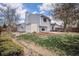 View of backyard featuring a storage shed, wood deck and lawn at 17802 E Bates Ave, Aurora, CO 80013