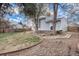 Backyard view featuring a lawn area, garden beds, and wood fence at 17802 E Bates Ave, Aurora, CO 80013