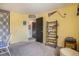 Cozy bedroom featuring neutral carpet, a window, and decor at 17802 E Bates Ave, Aurora, CO 80013