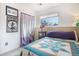 A charming bedroom with a bright window and cheerful decor at 17802 E Bates Ave, Aurora, CO 80013