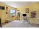 Bright bedroom featuring neutral carpet, a window, and ample natural light at 17802 E Bates Ave, Aurora, CO 80013